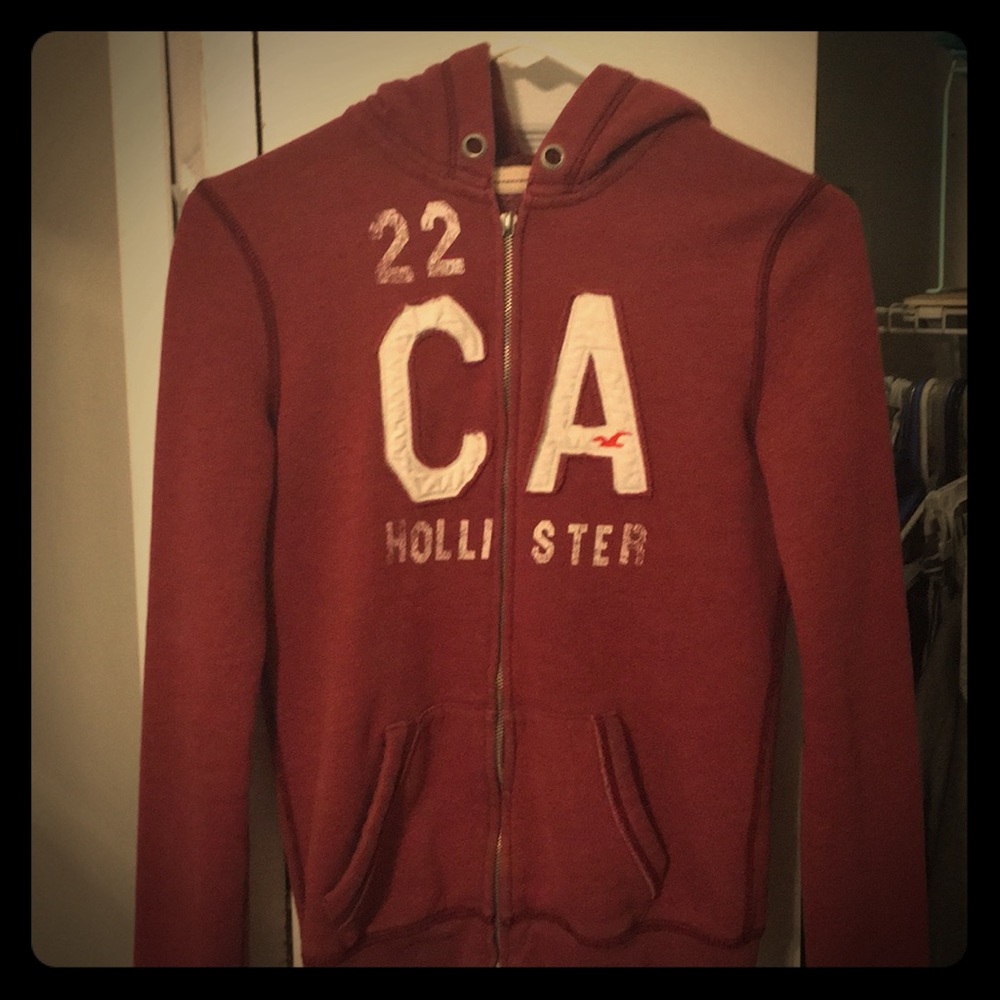 Maroon Hollister zip-up sweatshirt.